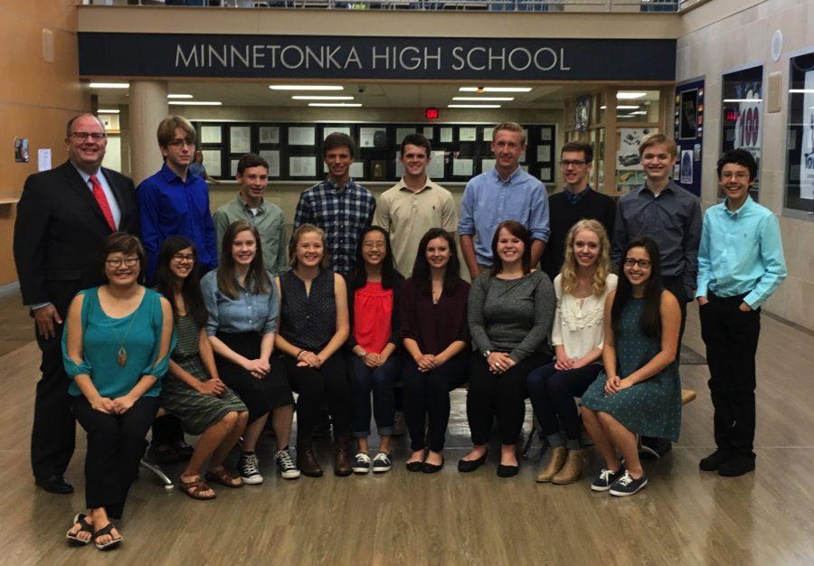 Jeff Erickson poses with National Merit Scholars.