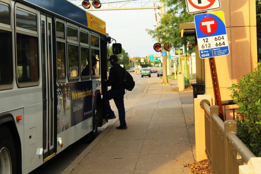 This commuter boards a public bus in Minneapolis.