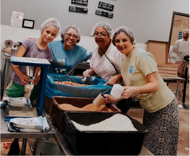 Packing meals for children in Haiti.