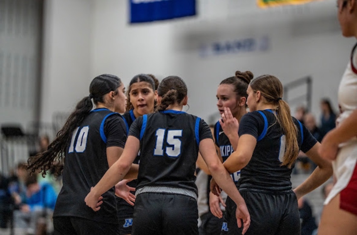 The team huddles together to pump each other up before the game continues | Photo courtesy of Micah Chose