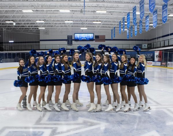 The Ice Skippers pose with their pom-poms and skates| Photo courtesy of Noa
Simms